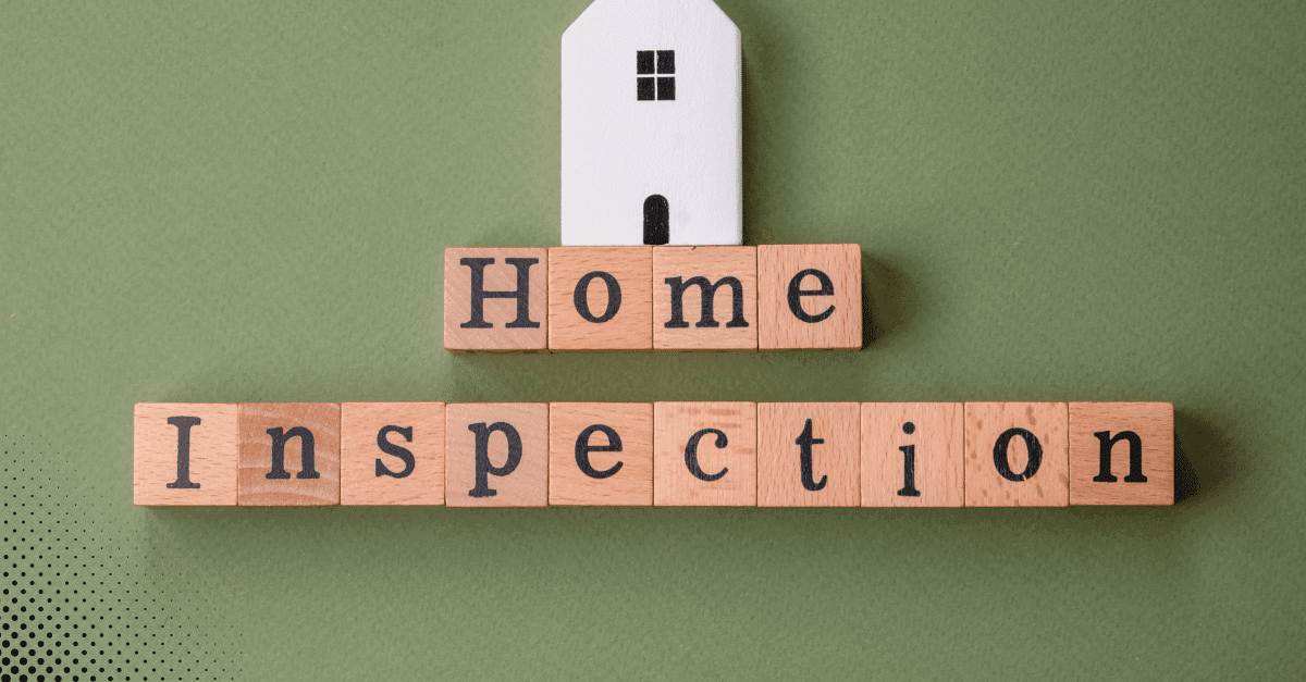 Wooden blocks spelling out Home Inspection with a small house on top.