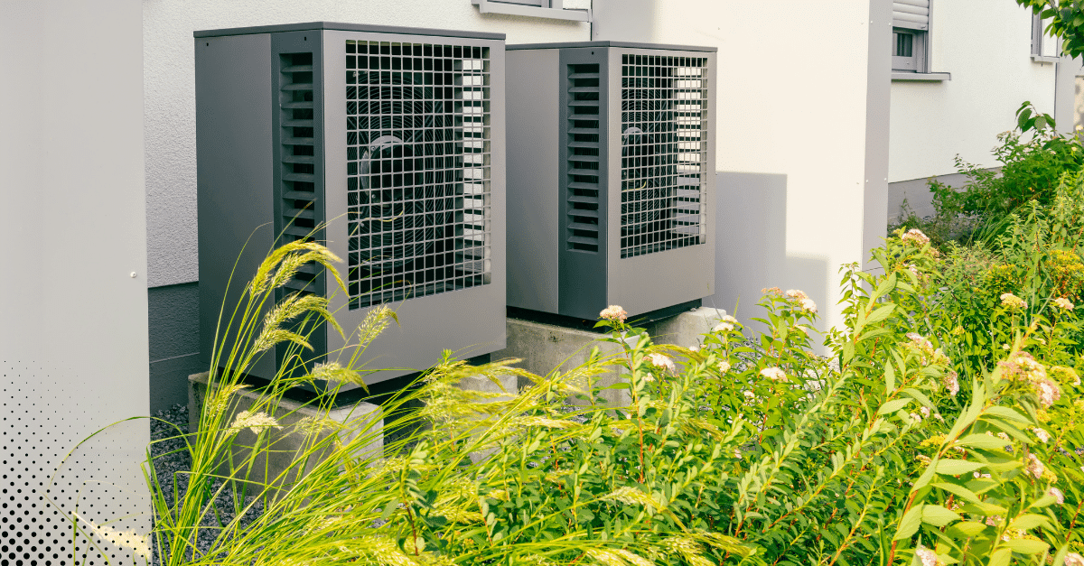 Outdoor heat pump units next to a residential building